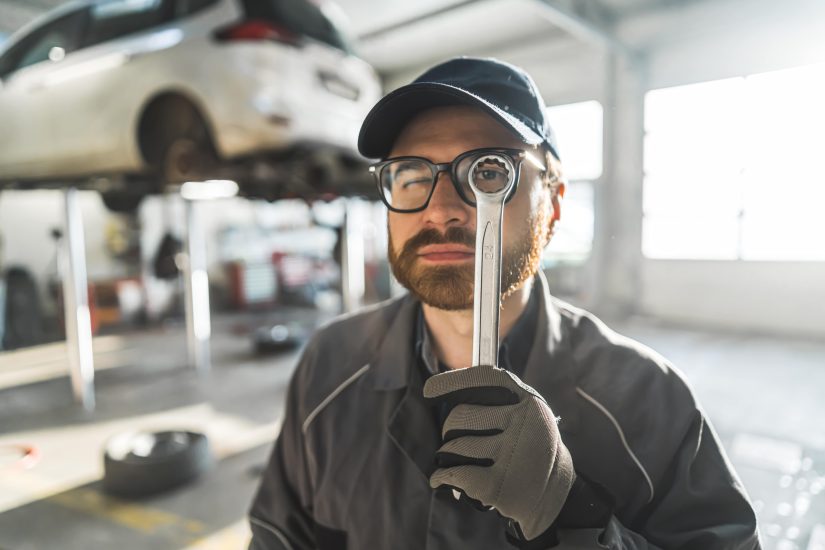 Man Holding A Wrench To An Eye